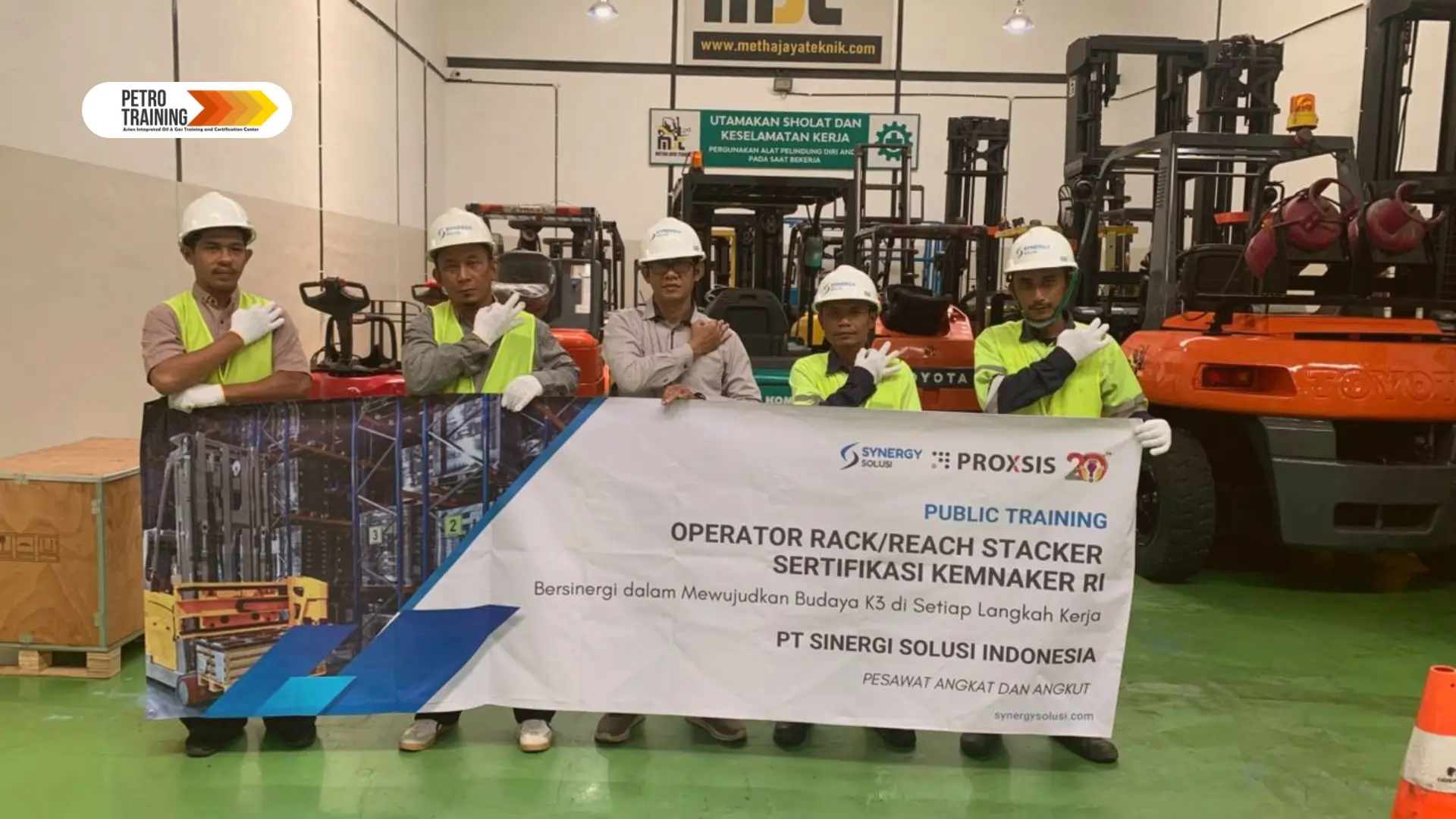 Participants in PetroTraining operator forklift class with training equipment
